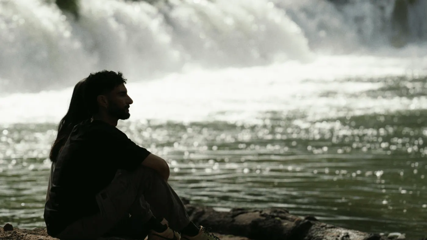 A guest resting by a waterfall in Peneda-Gerês